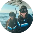 An image of two divers on a West Florida Shark Diving Boat. 